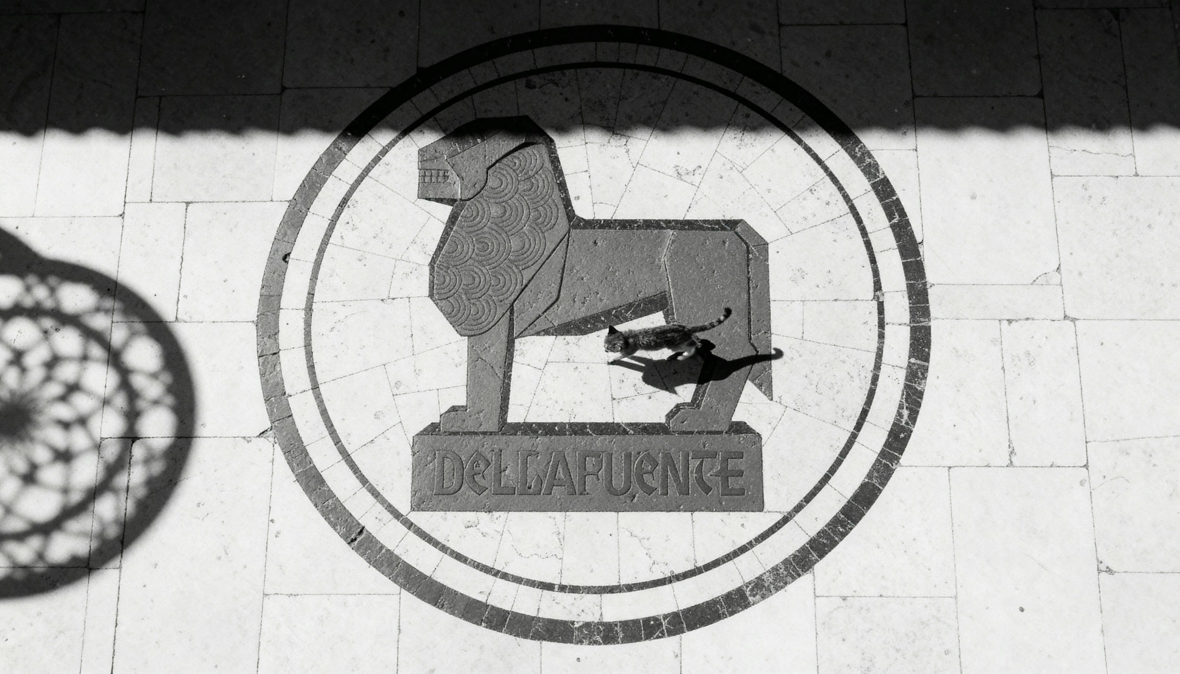 The DELLAFUENTE lion seal set into the wall