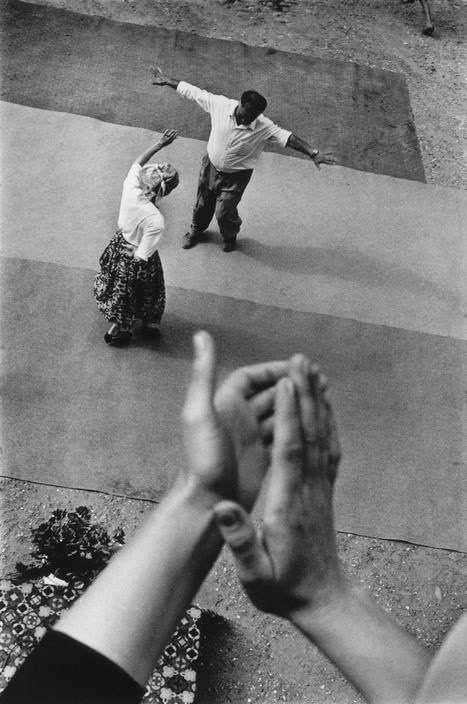 Hands clapping above a dancing couple, from Cristina Garcia Rodero