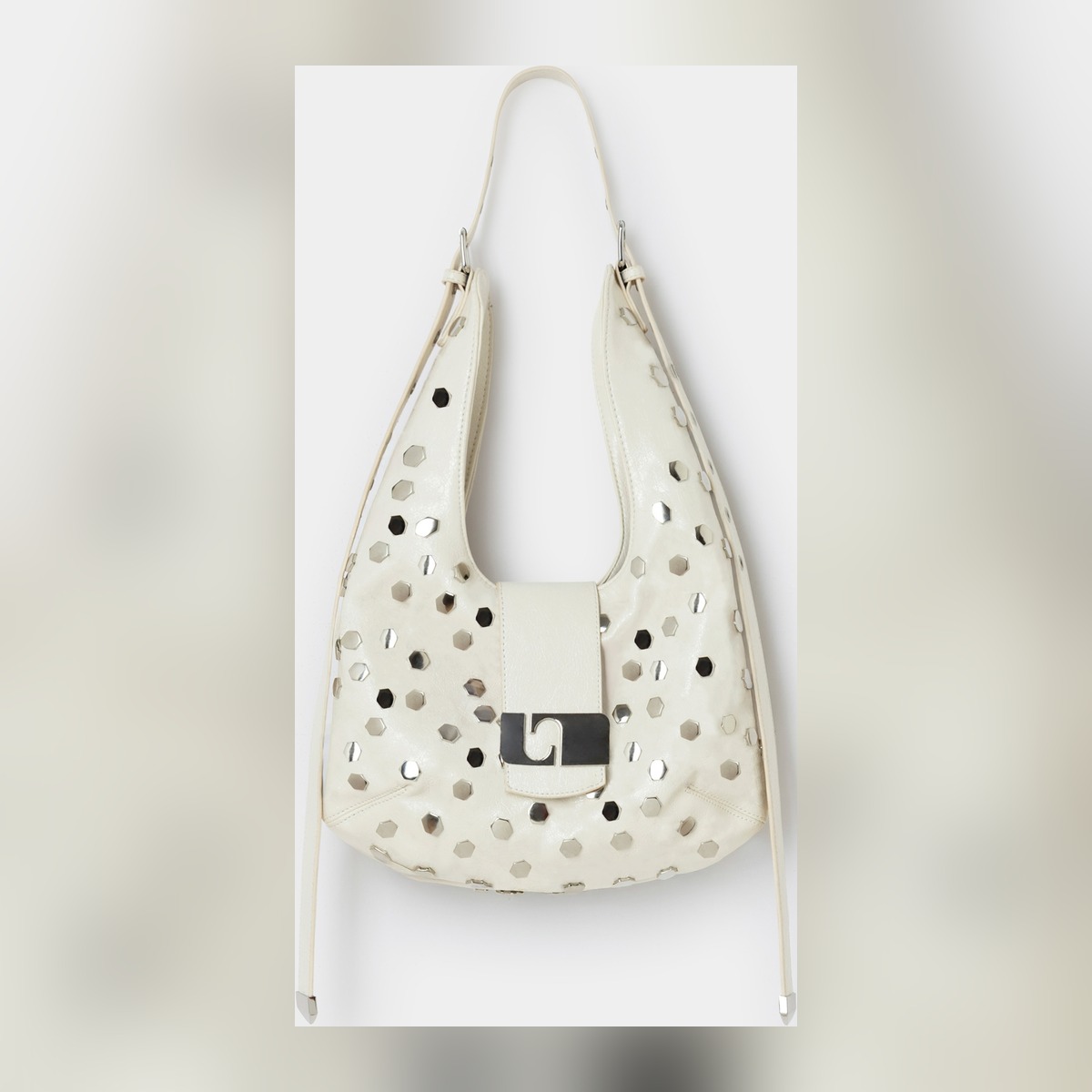 The cream VIXEN bag with silver studs, cut out on white